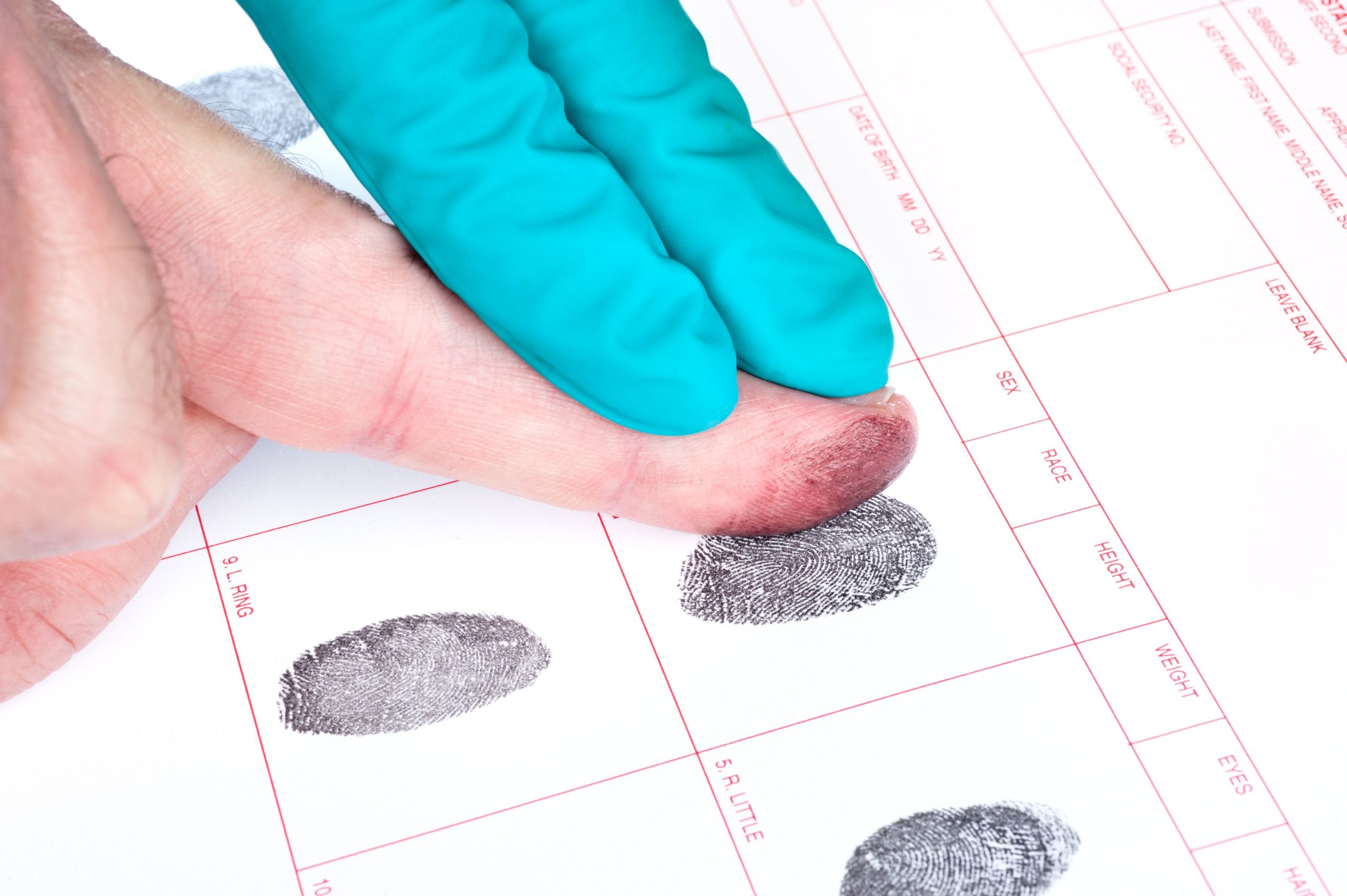 Man being fingerprinted